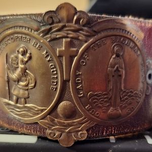 Leather wrist cuff with antique Saint Christopher medal